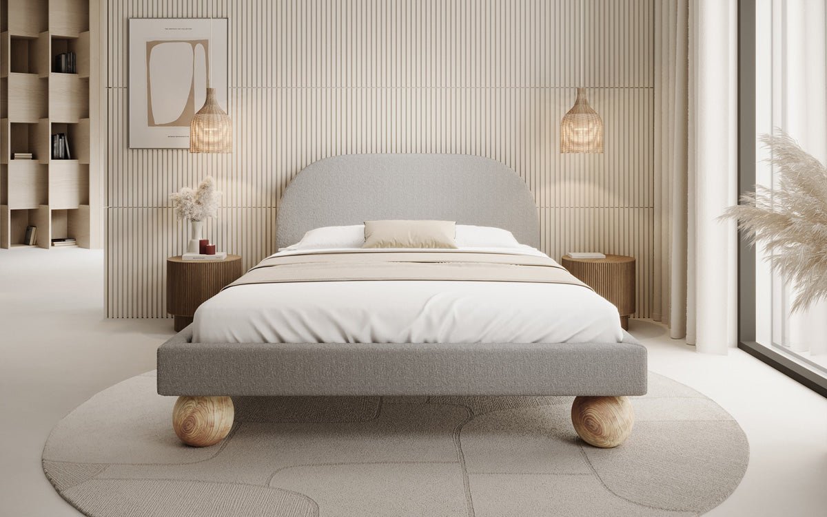 Designer upholstered bed Milo in bouclé with round wooden feet