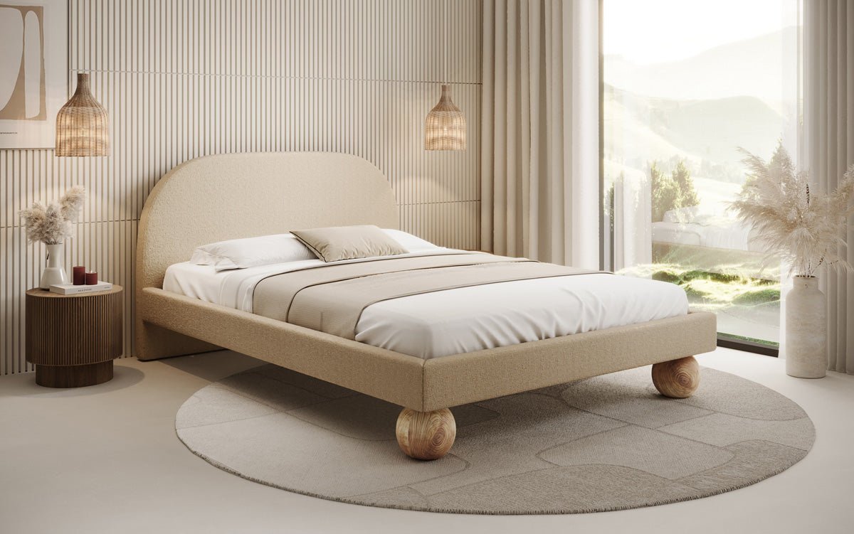 Designer upholstered bed Milo in bouclé with round wooden feet