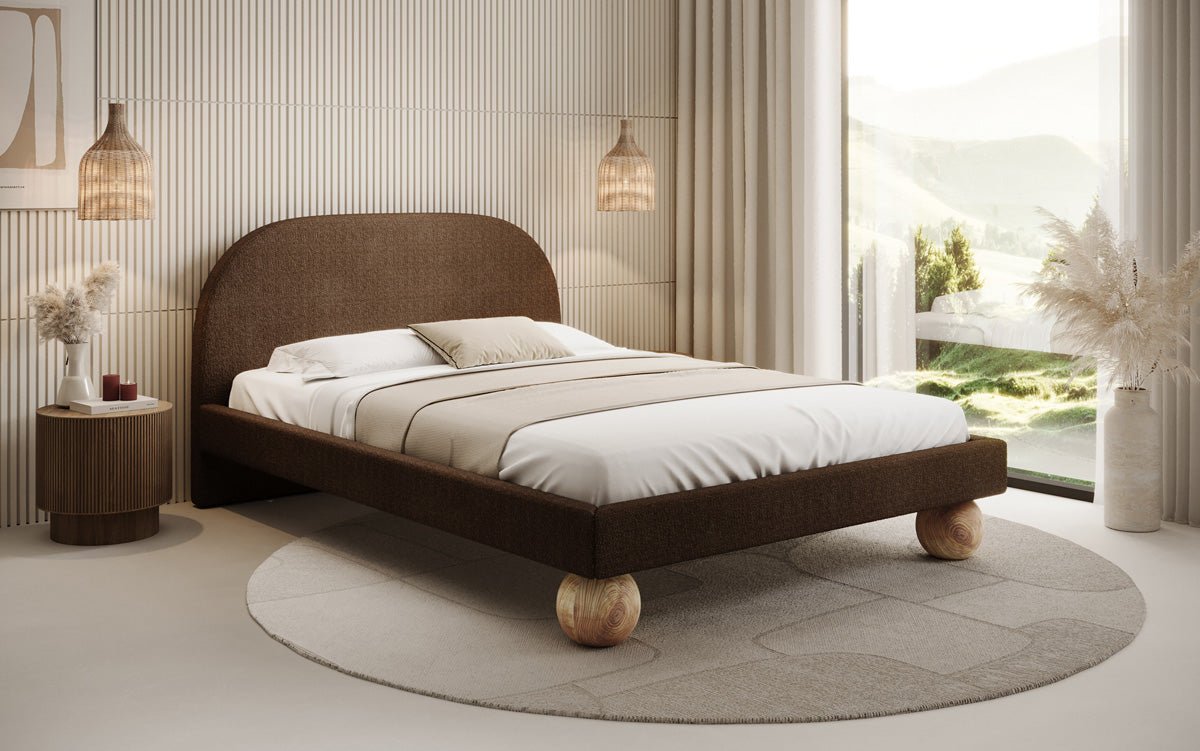 Designer upholstered bed Milo in bouclé with round wooden feet