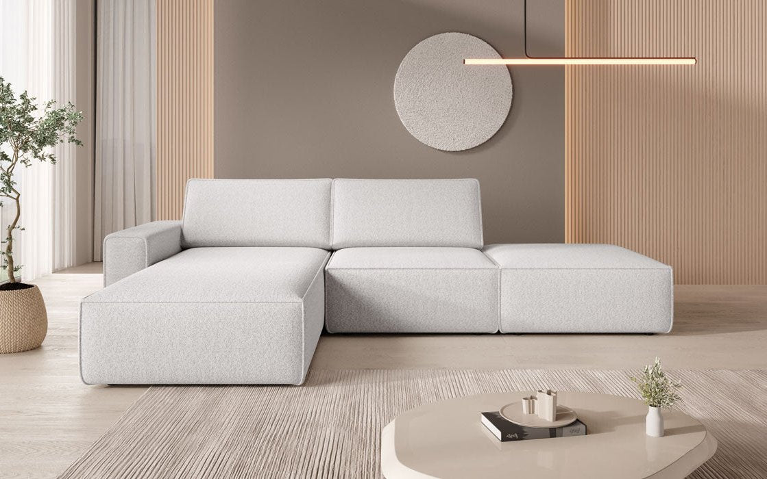 Canapé d'angle modulable Yuma avec tabouret latéral bouclé